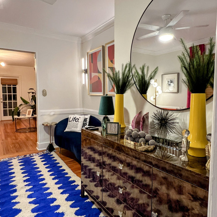 A Content Creator's Dream. Bold vibrant colors coupled with modern furnishings is just what this room needed. This client's desire is to have a room where she can relax and film content of her world t