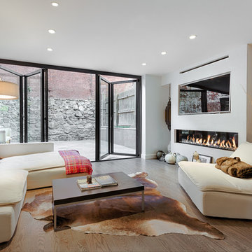 Living Room with Fireplace and Folding Doors