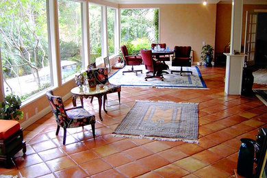 Tuscan family room photo in Austin with beige walls, no fireplace and no tv
