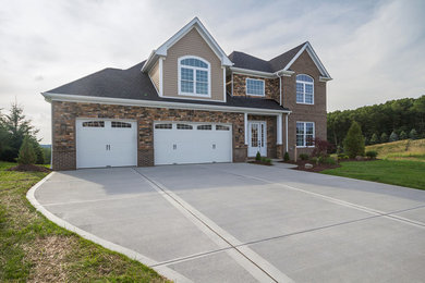 Inspiration for a large transitional brown two-story brick gable roof remodel in Other