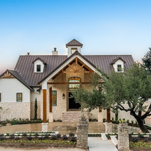 Wood (replace the wood beams in front of our house?  How about the eave