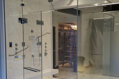 Alcove shower - large contemporary master white tile and porcelain tile marble floor and white floor alcove shower idea in Boston with white walls and a hinged shower door