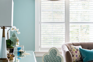 Inspiration for a timeless medium tone wood floor bedroom remodel in DC Metro with blue walls