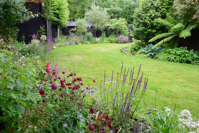 This is an example of a mid-sized contemporary backyard garden in London.