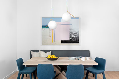 Inspiration for a contemporary light wood floor and beige floor dining room remodel in New York with white walls