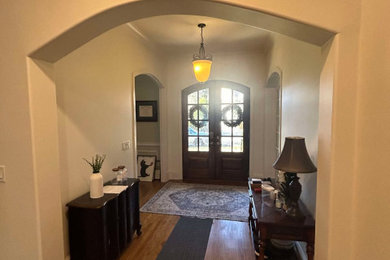 Inspiration for a mid-sized modern entryway remodel in Charlotte with white walls
