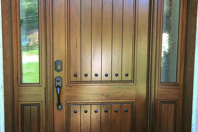 Example of a mid-sized mountain style entryway design in Philadelphia with a dark wood front door