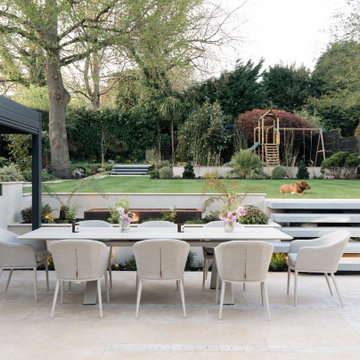 Contemporary Garden with Outdoor Kitchen and Fire Place Area, Cobham