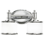 Vaxcel - Carlisle 2-Light Vanity Chrome - The Carlisle blends formal detailing with relaxed style for a transitional lighting collection that is sure to please. The frosted opal glass cylinders are smartly trimmed in chrome to match the rest of the fixture. This vanity is part of a full collection with coordinating pieces to decorate any room in the house. Versatile reversible mounting option lets you install this fixture up or down.