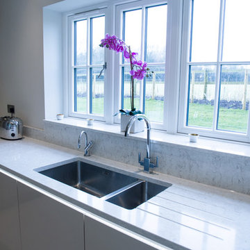 Contemporary high gloss cashmere & matt taupe kitchen