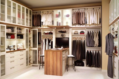 Design ideas for a large transitional gender-neutral walk-in wardrobe in Cleveland with white cabinets, flat-panel cabinets, carpet and white floor.