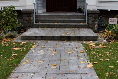 Mid-sized concrete floor front door photo in Vancouver with white walls