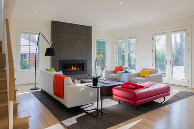 Photo of a large contemporary open concept living room in DC Metro with white walls, a ribbon fireplace and a metal fireplace surround.