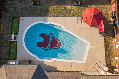 Pool - small craftsman backyard custom-shaped pool idea in Houston with decking