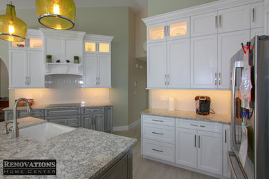 Inspiration for a large classic u-shaped kitchen pantry in Tampa with a belfast sink, engineered stone countertops, white splashback, ceramic splashback, stainless steel appliances, ceramic flooring, an island, grey floors and grey worktops.
