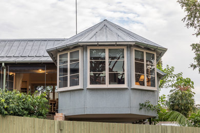 This is an example of a mid-sized traditional home design in Sydney.