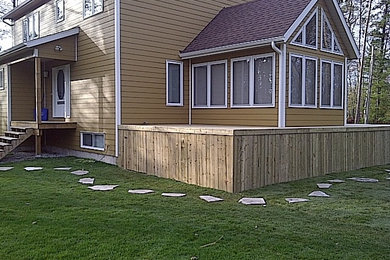 Inspiration for a large full sun stone landscaping in Toronto.