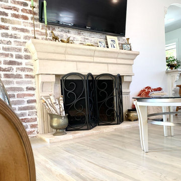 AFTER: WHITEWASHED BRICK FIREPLACE WITH CAST-STONE MANTEL