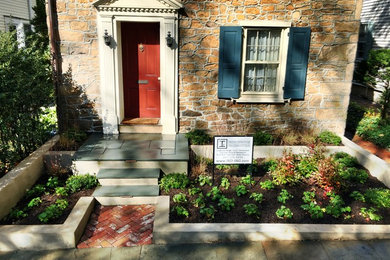 Inspiration for a small traditional front yard partial sun garden for spring in Philadelphia with concrete pavers.
