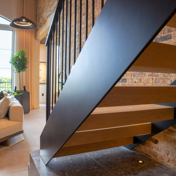 Metal staircase leading to living room