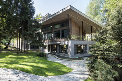 Immagine della facciata di una casa contemporanea con tetto piano