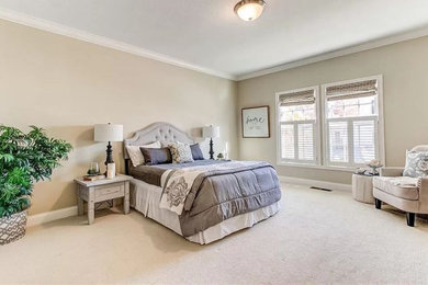 Mid-sized elegant master carpeted and beige floor bedroom photo in Indianapolis with gray walls