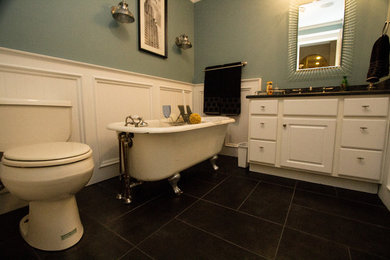 Mid-sized trendy 3/4 black tile and ceramic tile slate floor claw-foot bathtub photo in DC Metro with a drop-in sink, flat-panel cabinets, white cabinets, granite countertops and blue walls