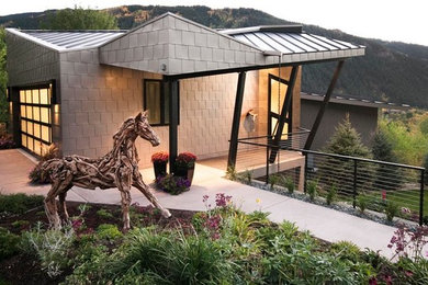 Mid-sized contemporary beige three-story mixed siding exterior home idea in Denver with a shed roof