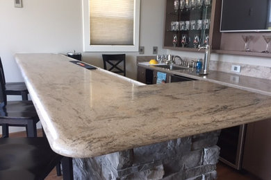 Wet bar - mid-sized traditional galley dark wood floor and brown floor wet bar idea in Chicago with an undermount sink, open cabinets, gray cabinets and solid surface countertops