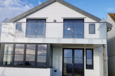This is an example of a beach style balcony in Sussex.