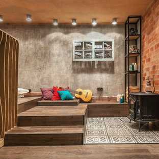 Design ideas for a small bohemian look-out basement in Moscow with grey walls, vinyl flooring and a wood burning stove.
