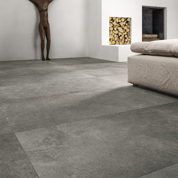 Modern white livingroom with large cement look porcelian tile