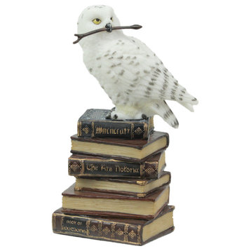 White Snowy Owl Perched On Stack of Magical Books Statue