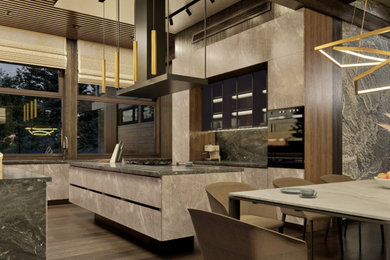 Inspiration for a large contemporary u-shaped eat-in kitchen in Moscow with an undermount sink, flat-panel cabinets, grey cabinets, marble benchtops, black splashback, porcelain splashback, black appliances, dark hardwood floors, with island, brown floor, black benchtop and wood.
