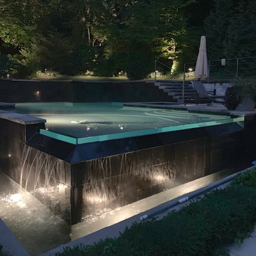 Infinity pool, patio, and landscape lighting in Toronto