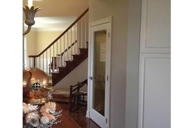 Example of a beach style entryway design in Detroit with gray walls
