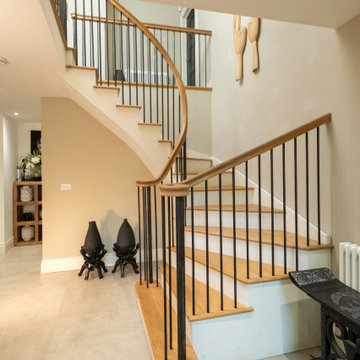 Elegant Curved Oak Staircase with Metal Spindles & Goose Neck