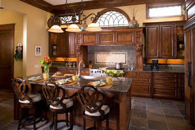 Elegant kitchen photo in Houston with granite countertops
