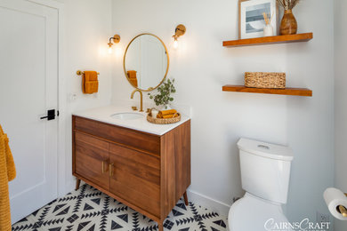 Inspiration for a mid-sized modern 3/4 single-sink bathroom remodel in San Diego with brown cabinets, a two-piece toilet, white walls, an undermount sink, a hinged shower door, a niche and a freestanding vanity