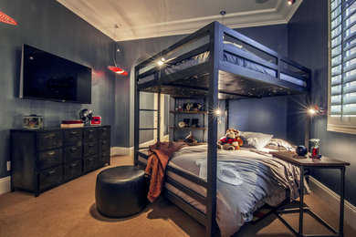 Inspiration for a small industrial carpeted bedroom remodel in Orange County with blue walls
