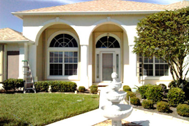 Inspiration for a white one-story exterior home remodel in Orlando