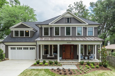 Inspiration for a transitional two-story mixed siding house exterior remodel in DC Metro with a shingle roof