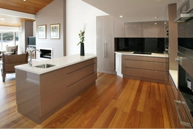 Design ideas for a mid-sized modern kitchen in Central Coast with with island.
