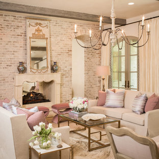 Foto de salón para visitas mediterráneo con paredes beige y chimenea de doble cara