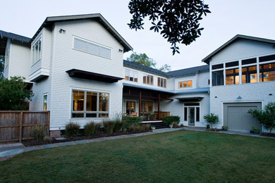 Example of a large transitional white two-story wood exterior home design in Houston with a shingle roof