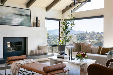 Example of a transitional formal and open concept vaulted ceiling, exposed beam, shiplap ceiling, dark wood floor and brown floor living room design in San Diego with a standard fireplace, white walls and a metal fireplace