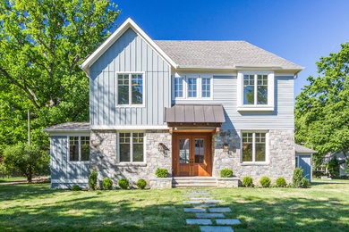 Mid-sized transitional two-story house exterior photo in DC Metro