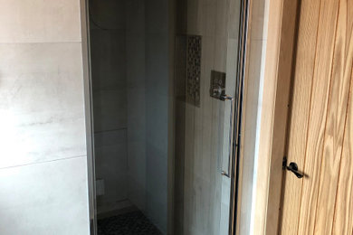 Inspiration for a small contemporary master bathroom in Other with a curbless shower, a hinged shower door and a shower seat.