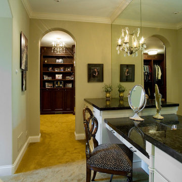 Master dressing room with makeup table and large mirrors