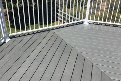 Inspiration for a huge backyard metal railing deck remodel in Other with no cover